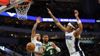 Damian-Lillard-0-of-the-Milwaukee-Bucks-is-defended-by-Cole-Anthony-50-and-Paolo-Banchero-5-of-the-Orlando-Magic-during-a-game-at-Fiserv-Forum-on-April-10-2024-aspect-ratio-16-9
